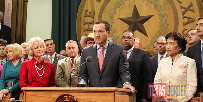Featured at microphone: Rep. Óscar Longoria, Jr., D-La Joya, flanked by fellow House members and law enforcement leaders in the Speaker’s Committee Room at the Texas Capitol, addressing reporters on Wednesday, March 11, regarding his filing of House Bill 12, which targets Mexican drug cartels and related crimes along the Texas border with Mexico. Photograph By HOUSE PHOTOGRAPHY 