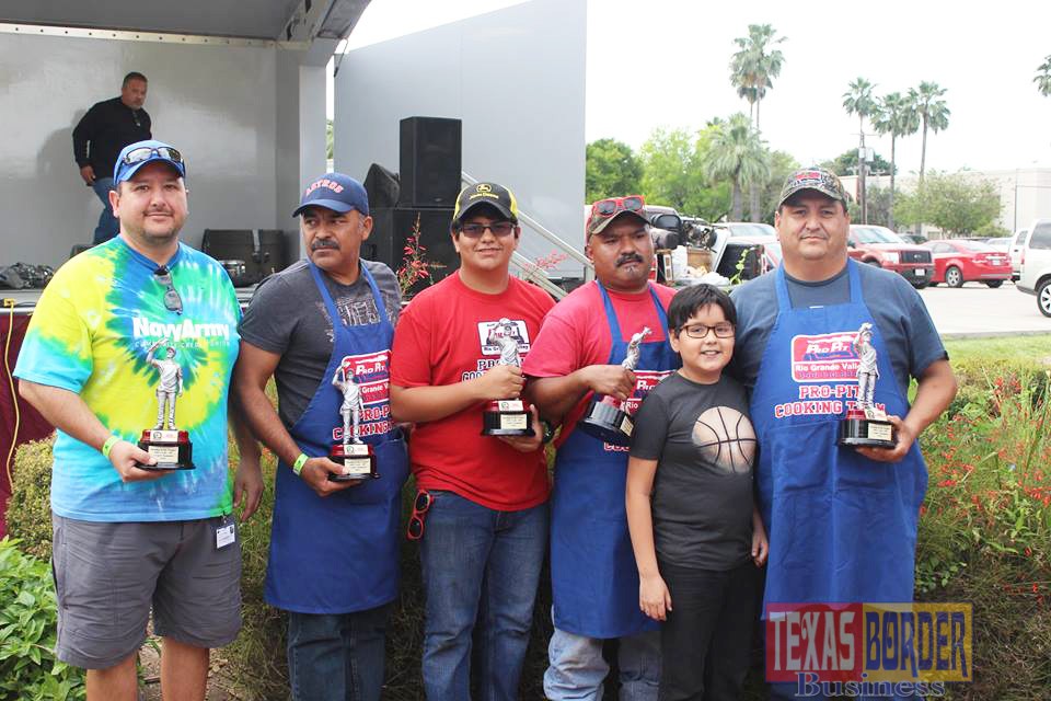 Proudly holding their Grand Champion trophies for the 5th time in a row are members of the Pro Pit Cooking Team from left Arnold Soto, Julio Vega, Andy Garcia, Aldo Perez, Diego Garcia and Baldemar Garcia